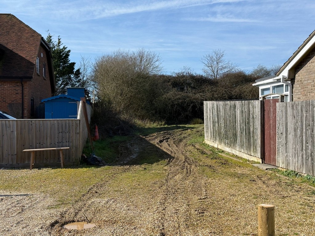 Lot: 106 - LAND WITH CONSENT FOR TWO THREE-BEDROOM HOLIDAY BUNGALOWS - View of access from Ashey Park